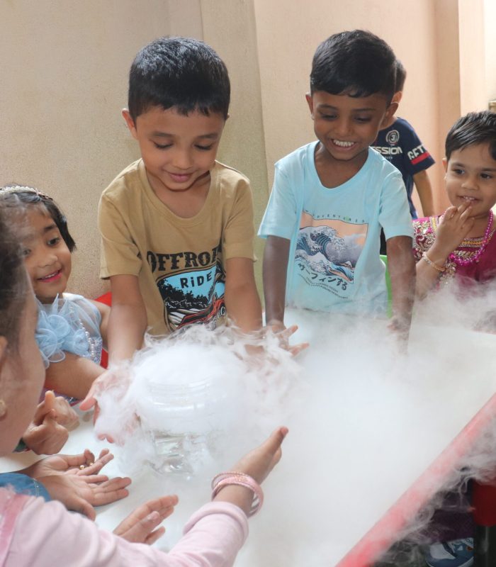kids participating in robotics workshop for schools